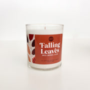 Candle with 'Falling Leaves' label on a white background
