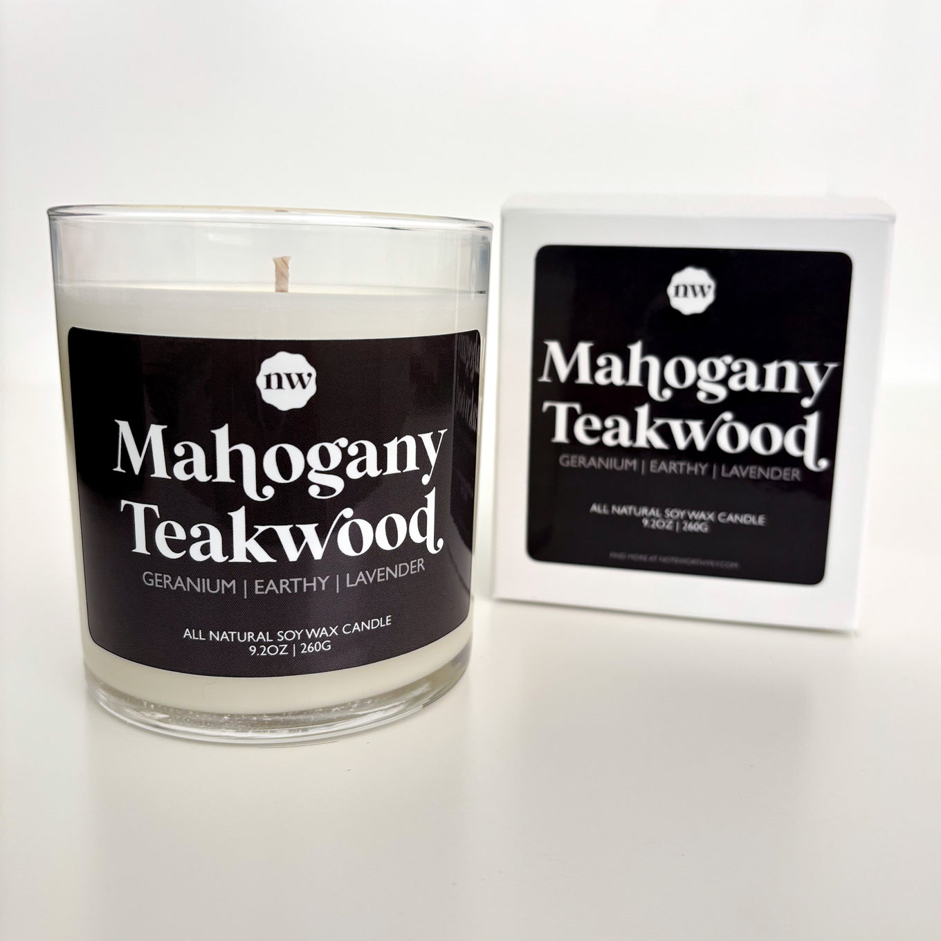 Candle labeled 'Mahogany Teakwood' with packaging