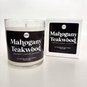 Candle labeled 'Mahogany Teakwood' with packaging